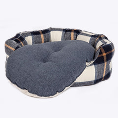 The Bowmore Deluxe Slumber Dog Bed showing the grey fleece side of the dog bed