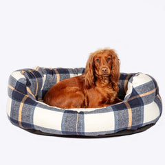 The Bowmore Deluxe Slumber Dog Bed with a dog laying in the bed