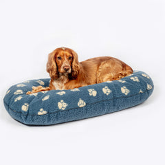 Danish Design Sherpa Fleece Quilted Mattress Dog Bed in Blue Harbour esign with paw print and a dog layed on the bed