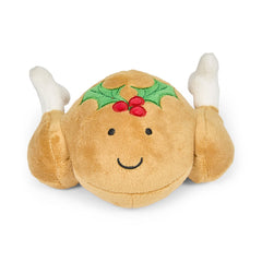 Plush toy resembling a roasted turkey with a holly berry decoration