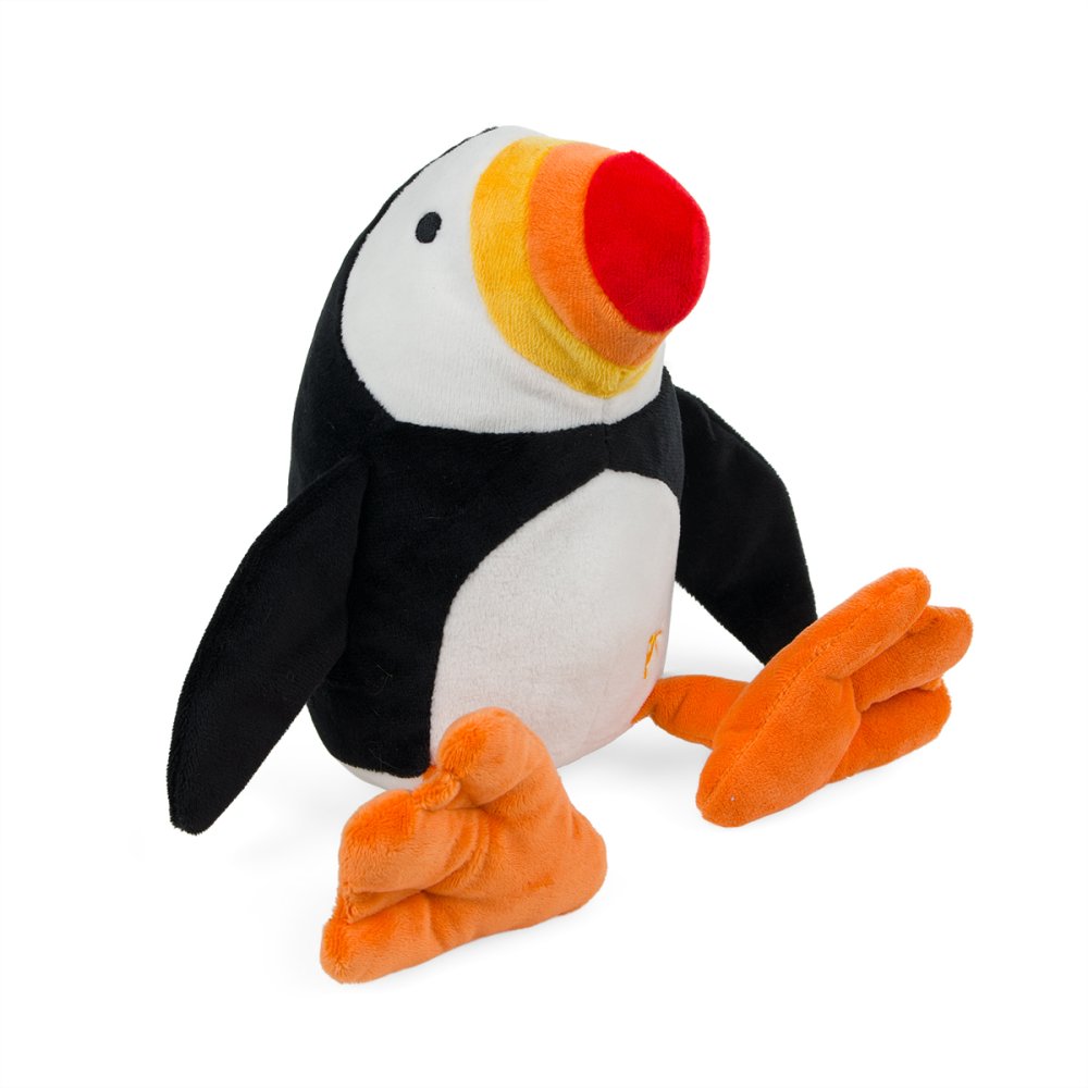 A plush toy penguin with a black and white body, a yellow and orange beak, and orange feet, photographed on a clean white background.